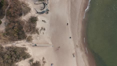 AERIAL:-Top-View-of-Sandy-Melnrage-Beach-in-Klaipeda-with-old-World-War-II-Battery