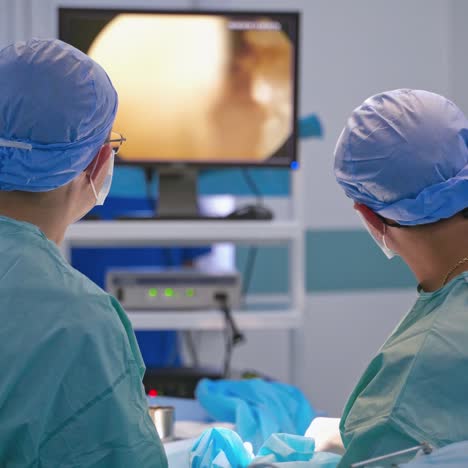 surgeons operating patient