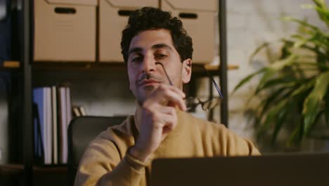 man working on laptop in office