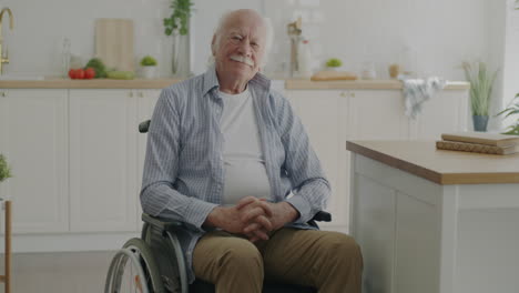 senior man in wheelchair in kitchen