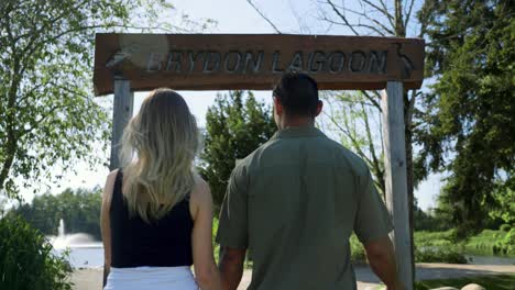 A-couple-and-their-dog-are-walking-towards-Bryden-Lagoon