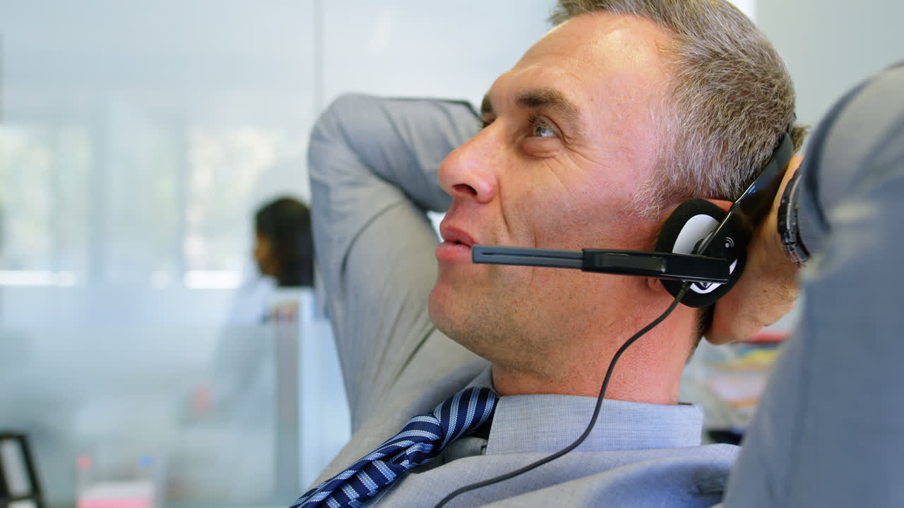 Executive talking on headset in office 4k