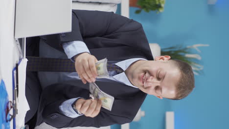 vertical video of home office worker man making money and feeling happy.