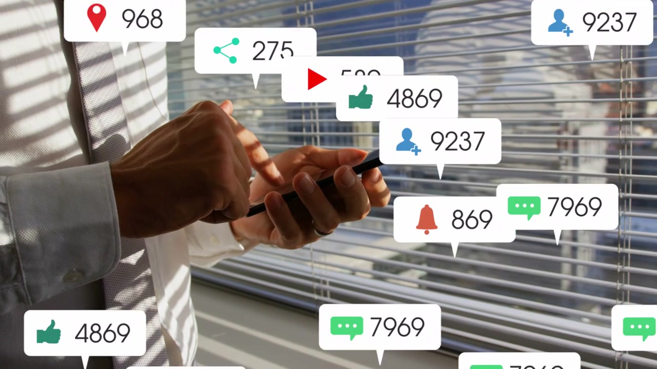 Man tapping smartphone by window, creating multiplying notification bubbles, monitoring marketing