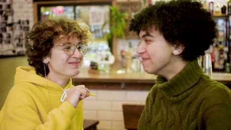 lesbian couple in a bar