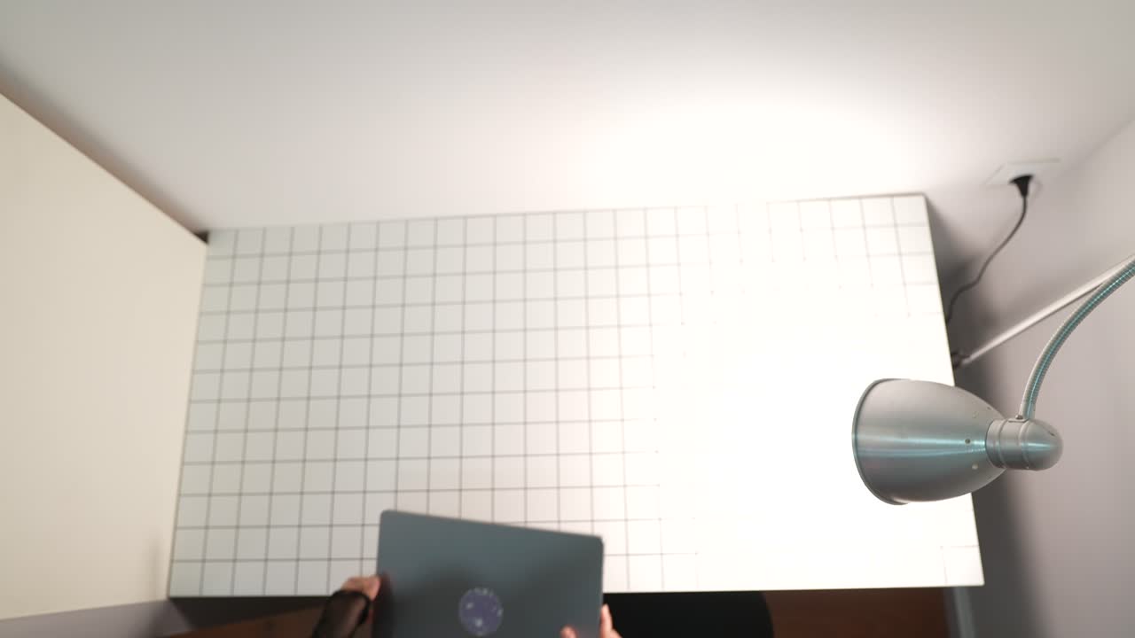 Woman working on a laptop in a photo studio