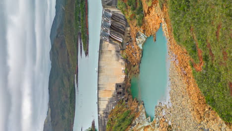 vertical hyperlapse flying towards yaté dam, new caledonia over unique landscape