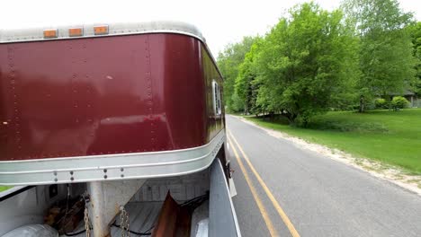 Pulling-a-gooseneck-horse-trailer-with-pickup-truck,-backview