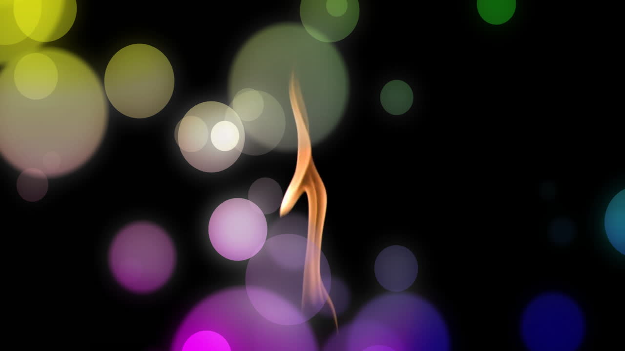 검은 바탕에 불꽃 위에 있는 빛의 반점들의 애니메이션