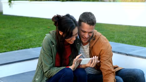 Couple-taking-selfie-with-mobile-phone-with-pet-dog-4k