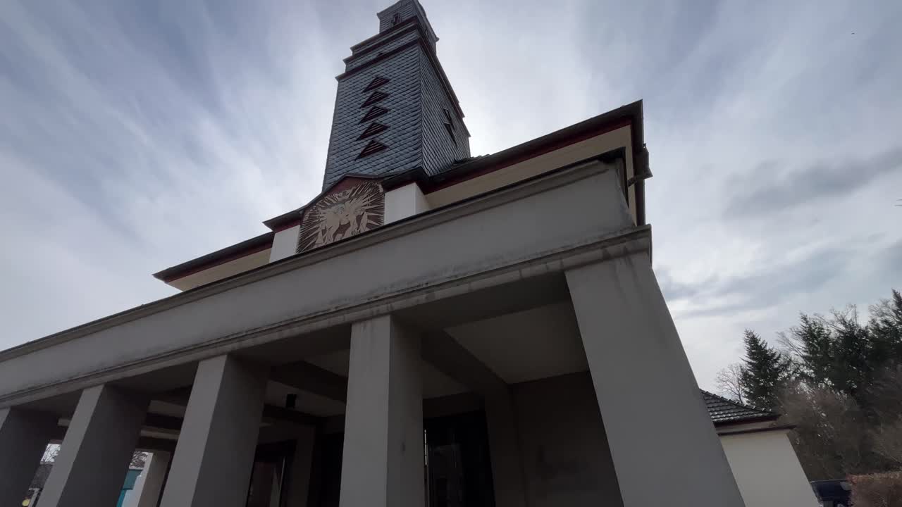 entrance to a small church sways high to the tower