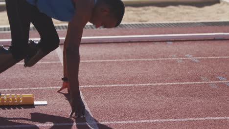 disabled mixed race man with prosthetic legs staring a race