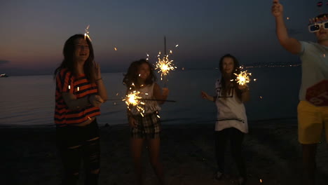 Friends-enjoying-New-Year-party-at-the-seaside