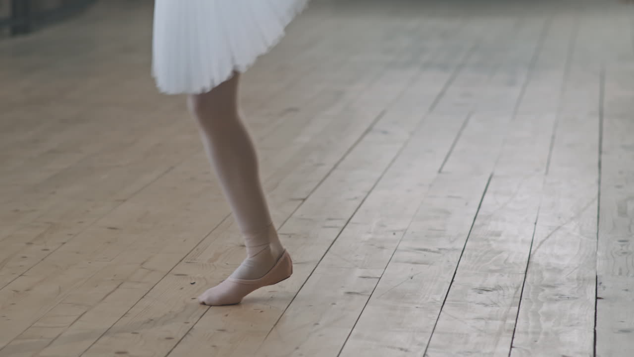 Little Ballerinas Legs Dancing On Wooden Floor