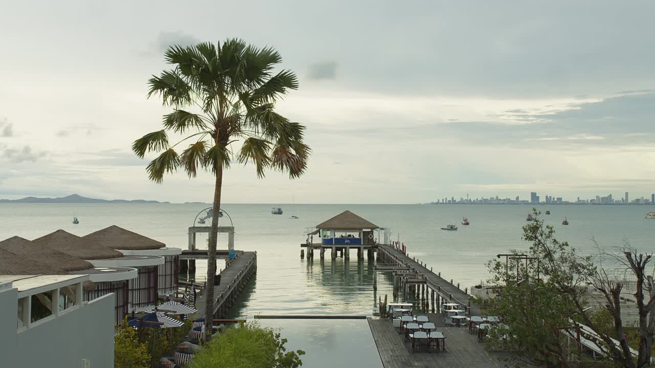 wooden pier over the water on the ocean at tropical beach and resort in Thailand, travel holiday vacation