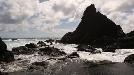 rocky pitcairn island with energic waves