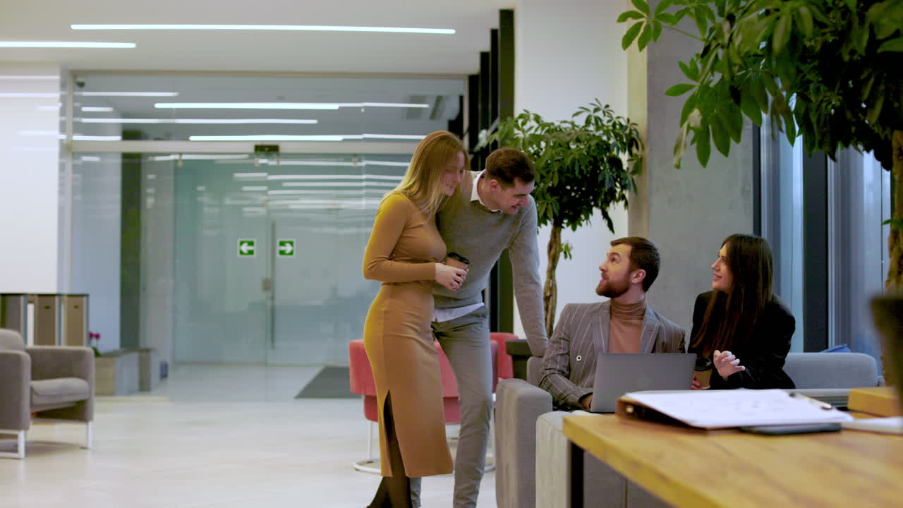 Coworkers talking in the office