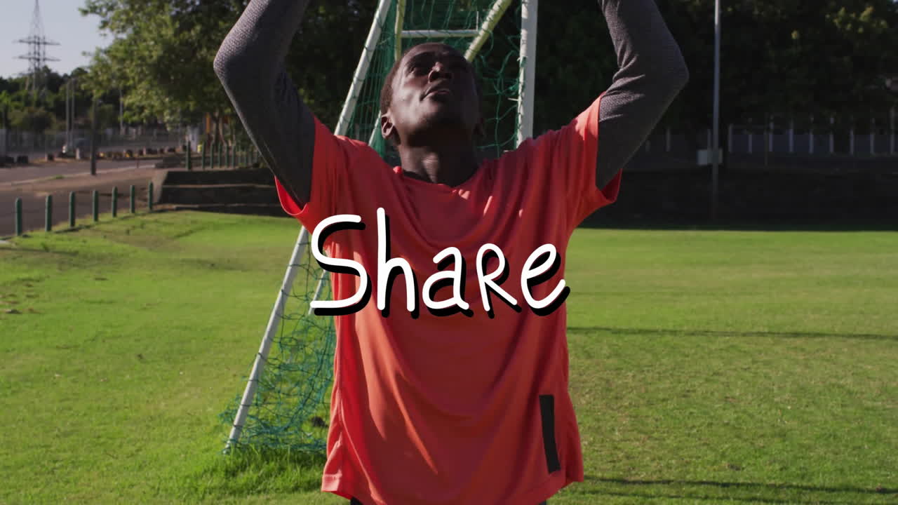 Holding ball, goalkeeper in orange jersey on field with animation text overlay