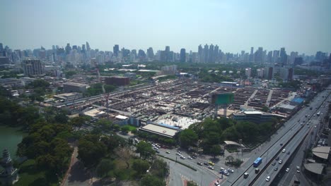 Panoramic-view-of-cityscape-and-construction-site-in-metropolis