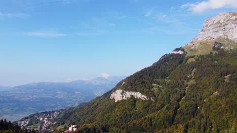 aerial tilt down view over passy, in the french alps, on a warm fall season day