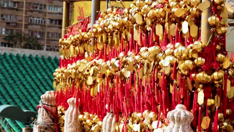 rows of golden bells with red tassels