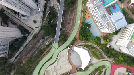 po kong village road park elevated cycling track and skatepark in downtown hong kong, high altitude aerial footage