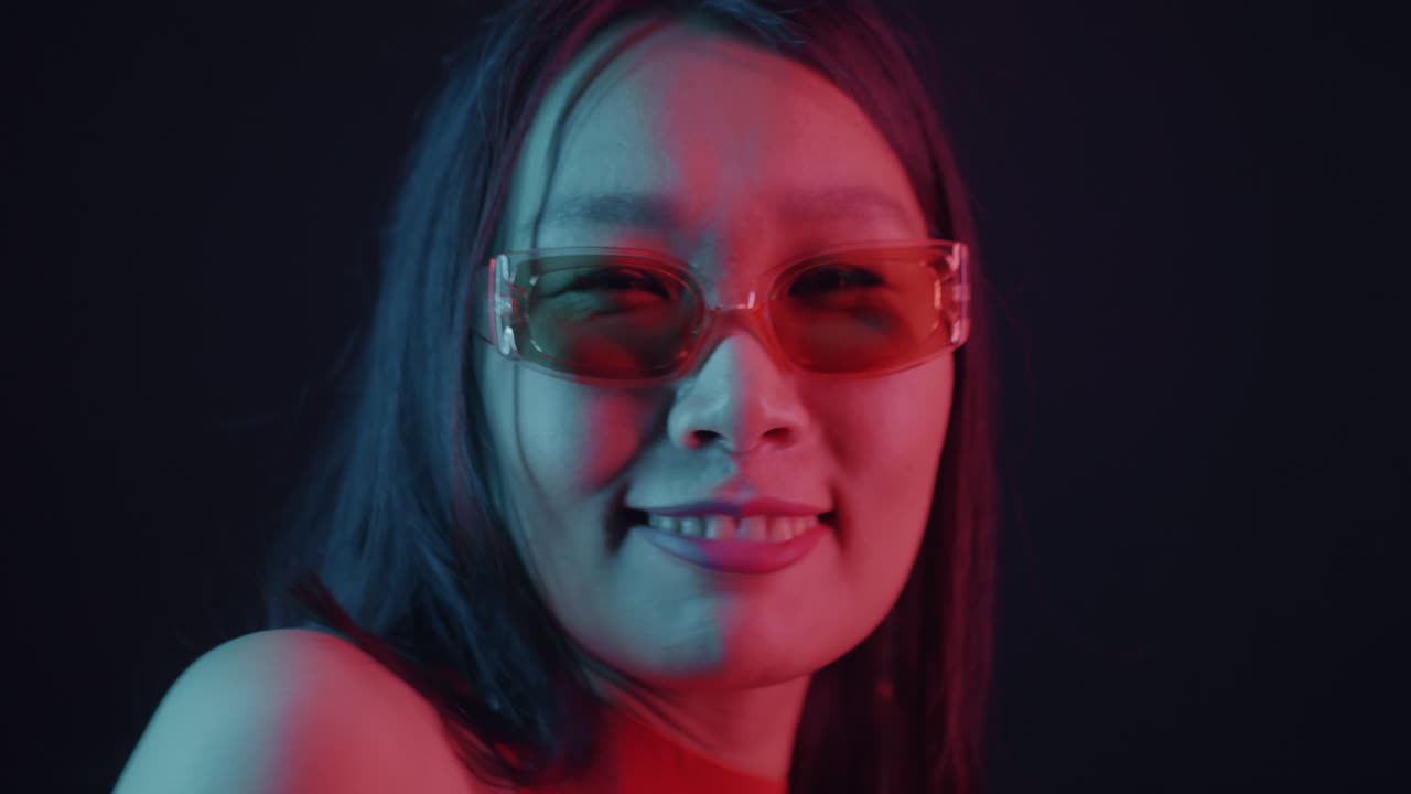 Stylish Woman Posing in Neon Lighting