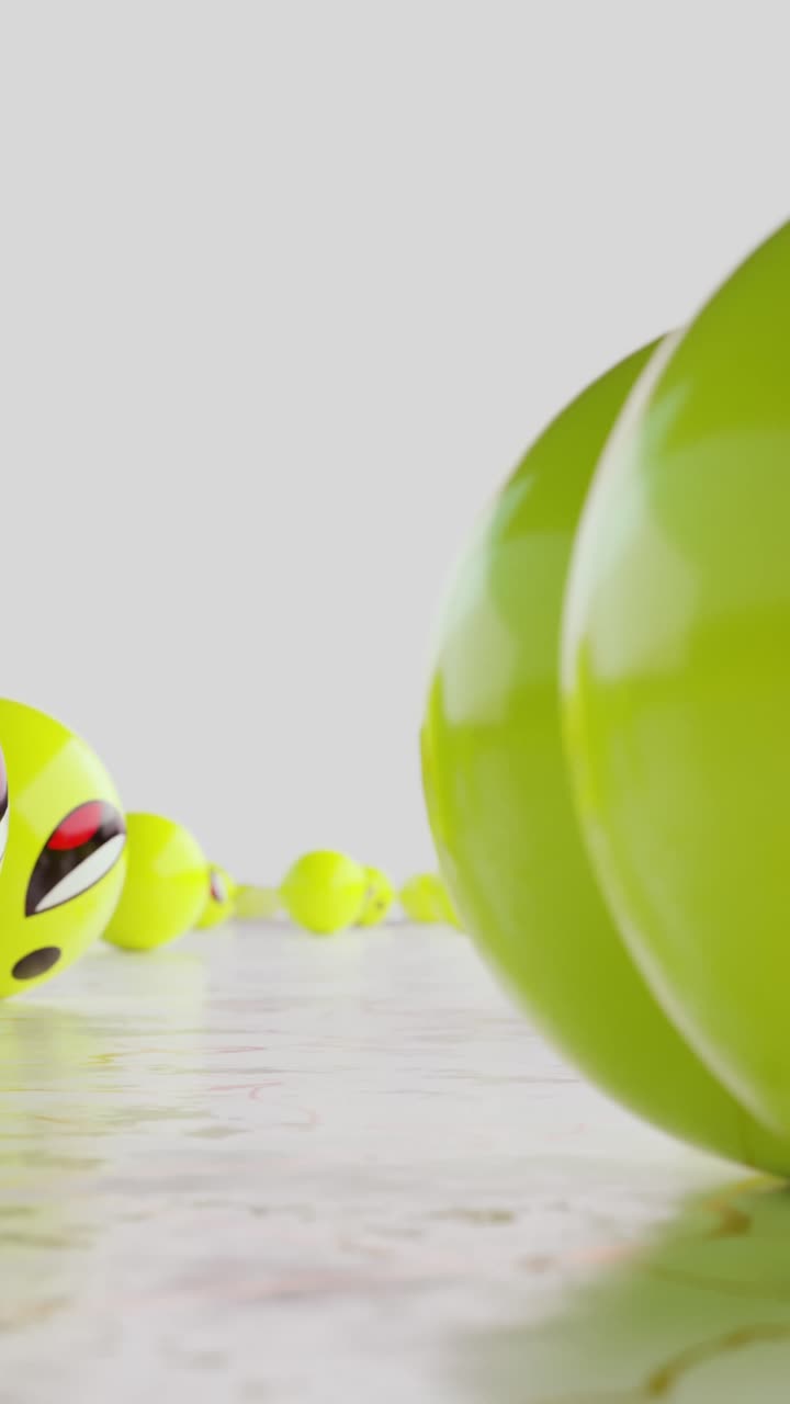 Yellow balls with smiley faces rolling across the endless floor. Vertical looped animation