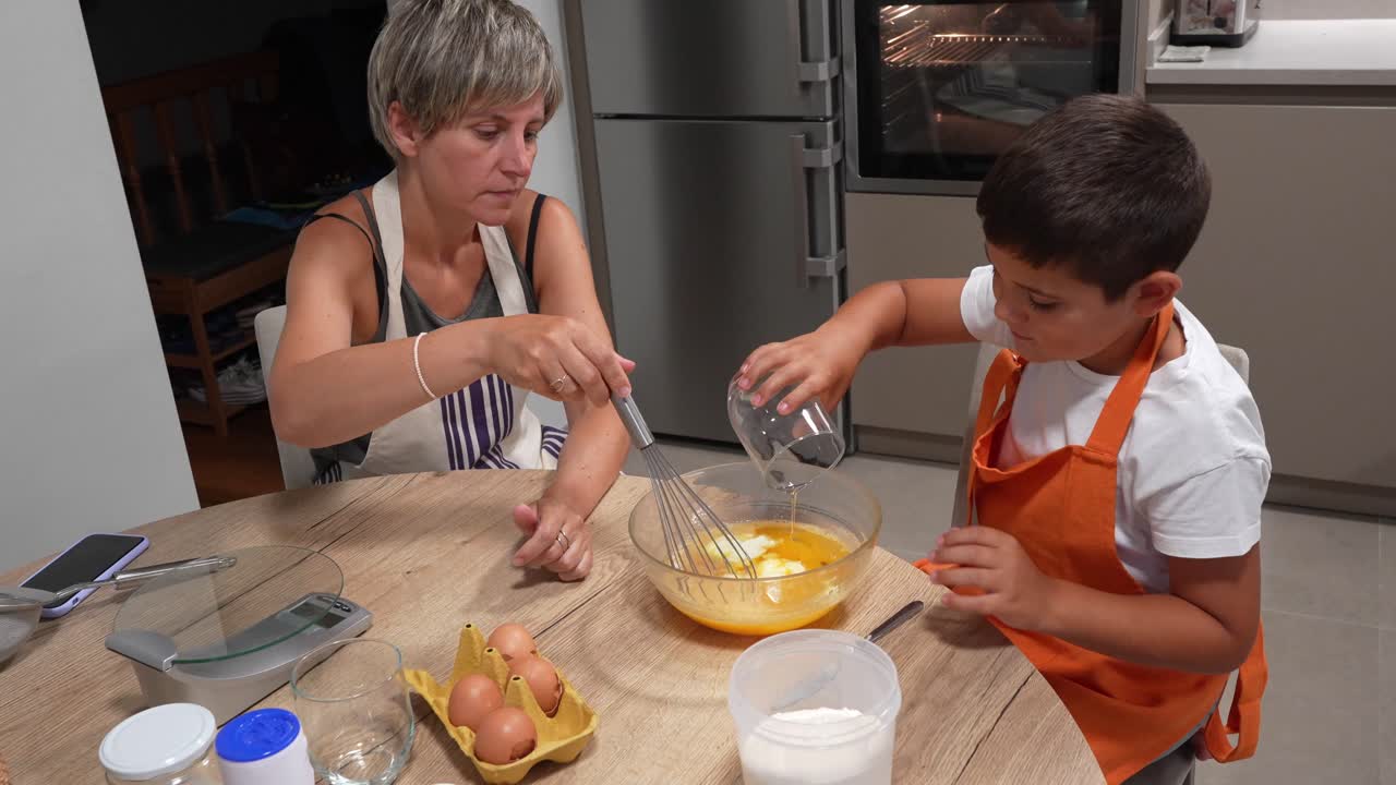 Mother and Son Baking Together in the Kitchen
