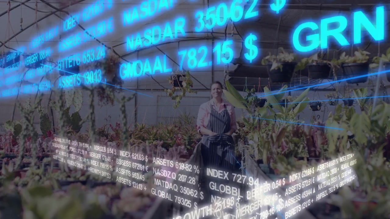 Nursery worker walking aisle, tending pots as finance tickers appearing around her for sales