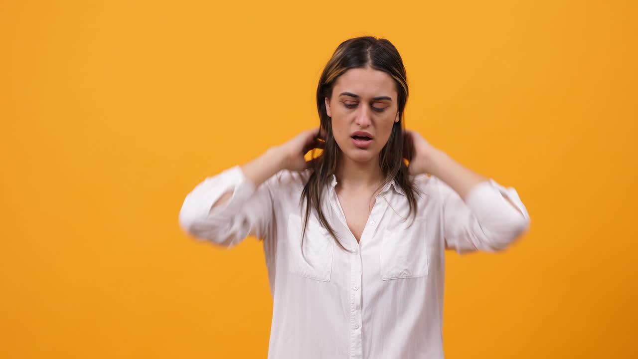 Woman expressing confusion and uncertainty on yellow background
