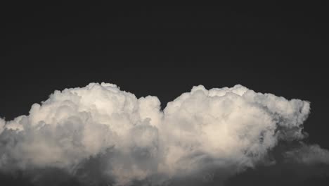 white smoke like clouds on a black sky background timelapse footage.