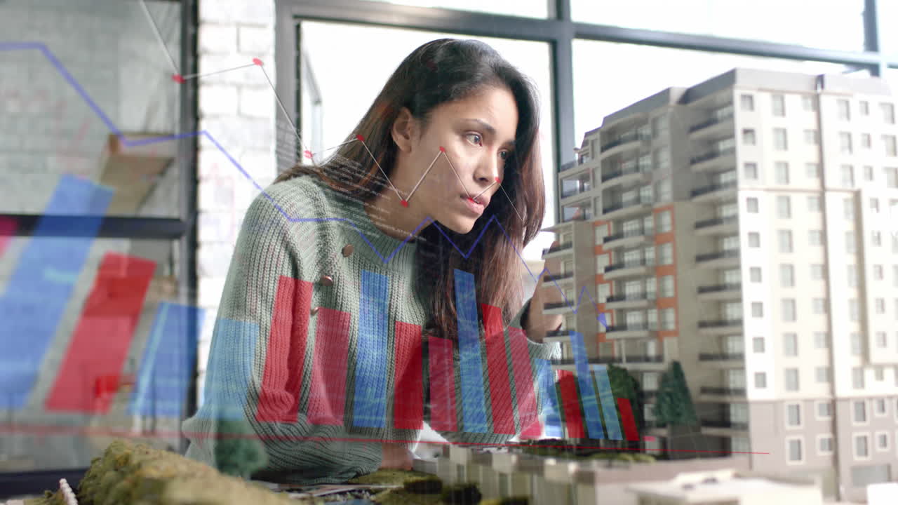 procesamiento de datos en gráfico sobre arquitecto femenino biracial estudiando el modelo de construcción