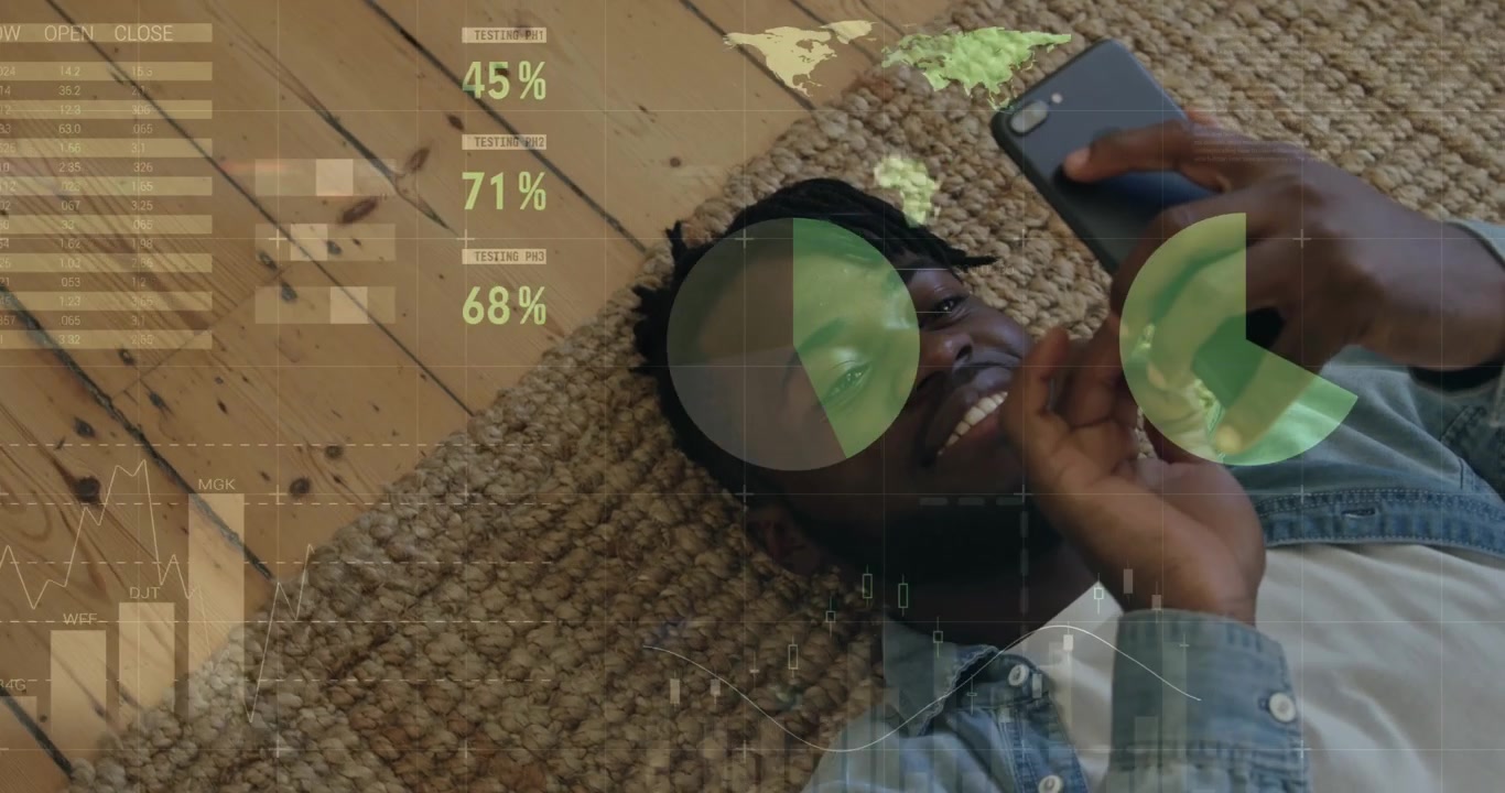Animation of infographic interface over lying african american man scrolling on smartphone