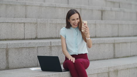 Businesswoman using mobile phone for video call. Woman chatting on phone