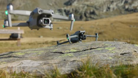 take off from rock of two professional drones