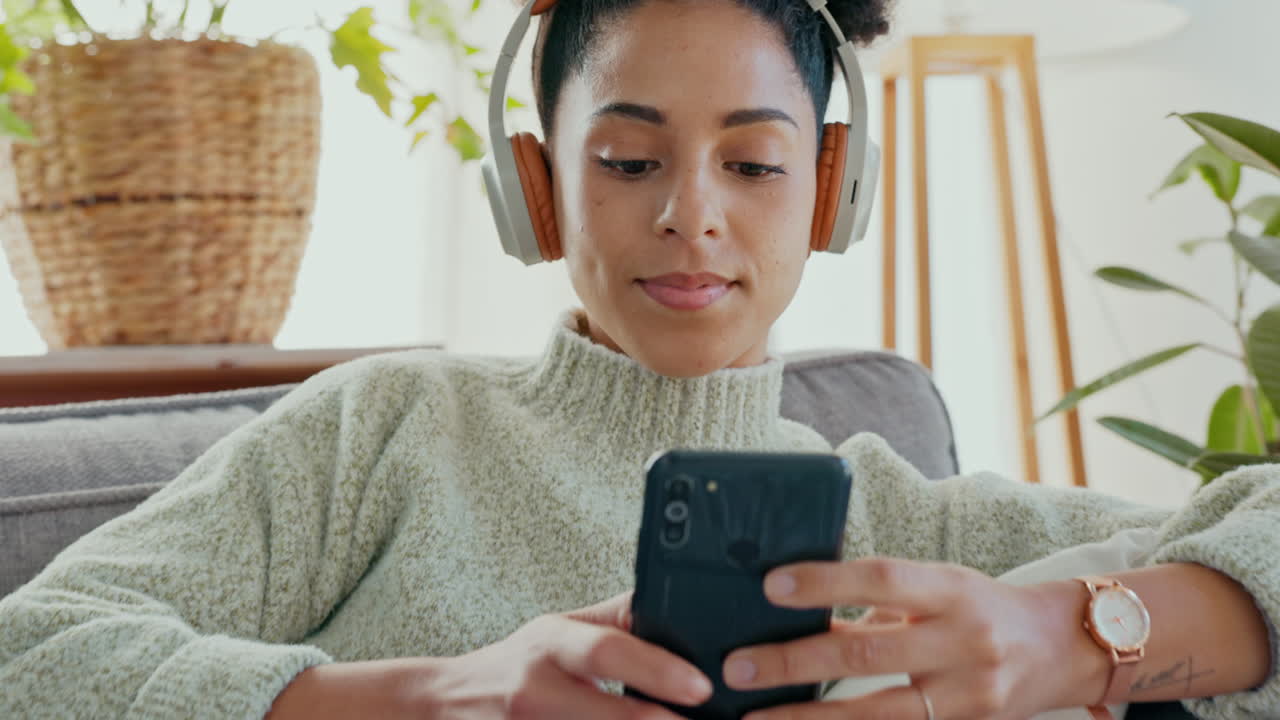 Woman Listening to Music and Using Phone