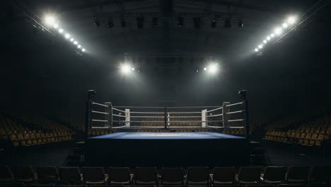 a profound stillness encircles a boxing ring amidst dim lighting and empty seats, capturing the anticipation before an electrifying match begins