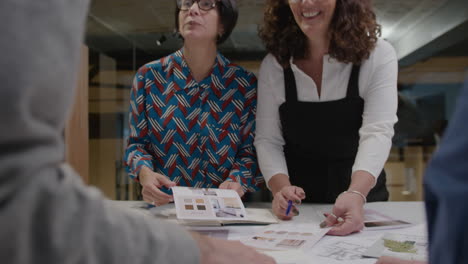 group of senior architects brainstorming in office