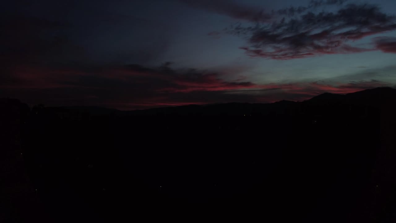 Sunset Silhouette over City Buildings