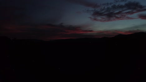 sunset silhouette over city buildings