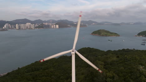 Aerial-view-of-rotating-wind-turbine-on-Lamma-Island-in-Hong-Kong