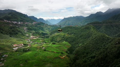 sapa fansipan gondola travels over scenic and verdant muong hoa valley, aerial