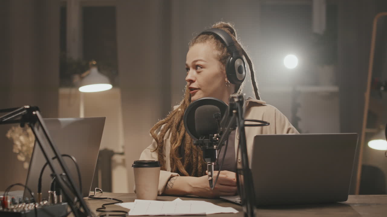 Cheerful Woman Recording Podcast at Home