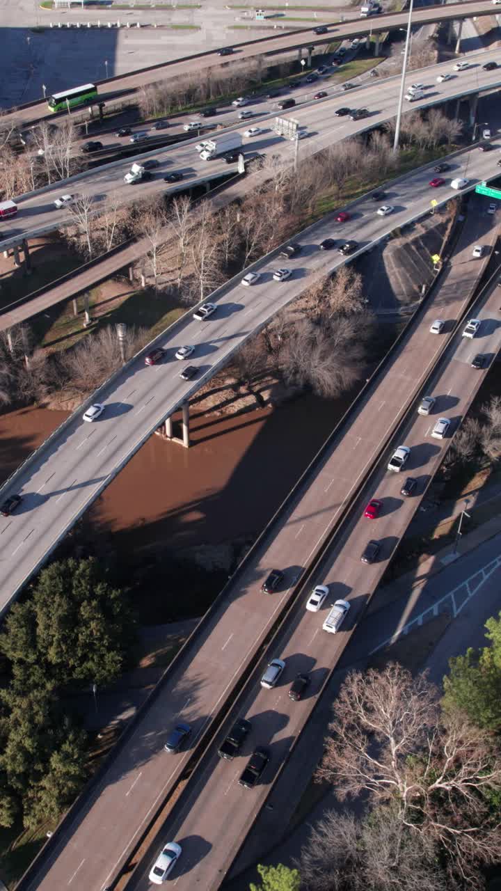 Aerial view of highway traffic over bridge and river