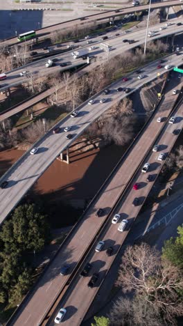 aerial view of highway traffic over bridge and river