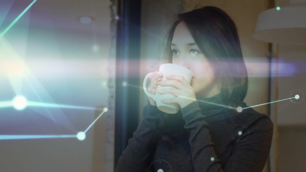 Woman holding white mug in technology workspace, showing glowing network lines and data nodes