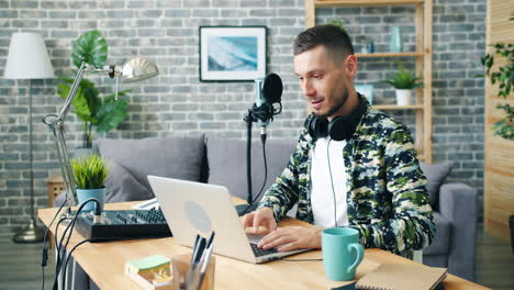 man podcasting from home