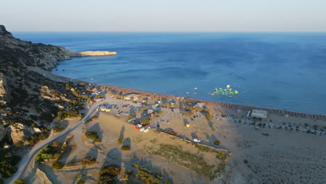 aerial view circling the paralia tsampika beach, sunset in rhodes, greece