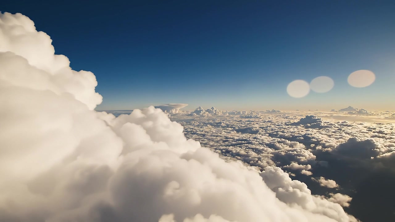 Aerial View of Fluffy White Cumulus Clouds at Sunrise